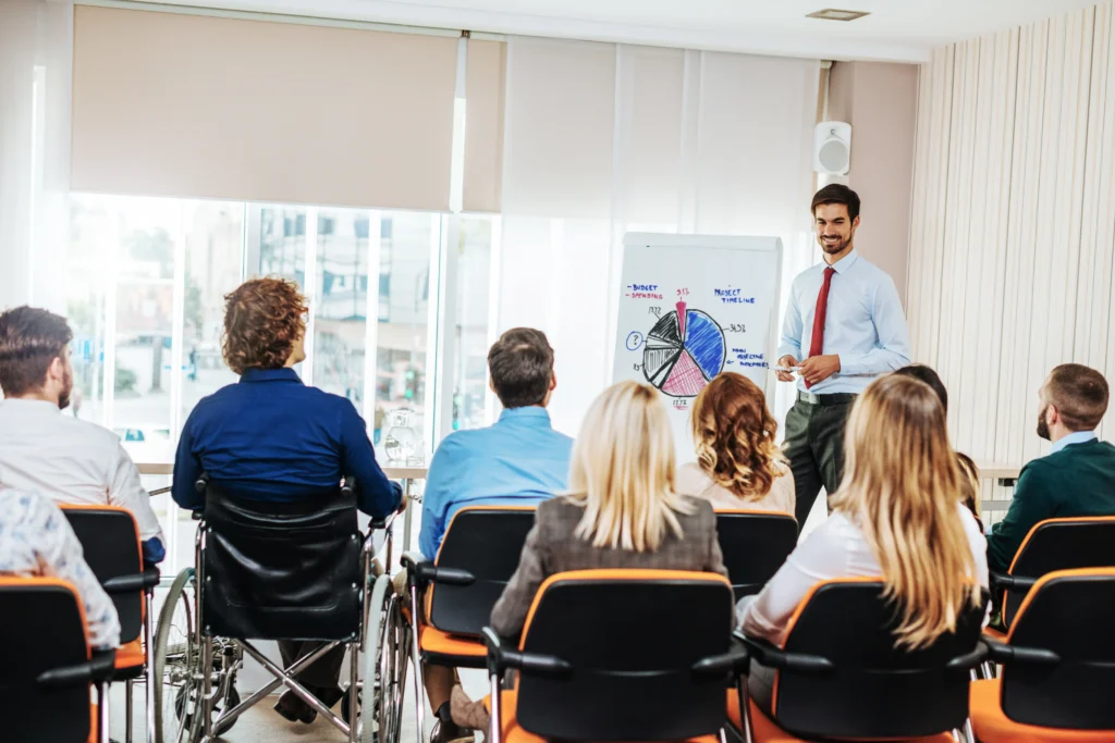 An instructor conducting a professional PMP training session with live coaching and participant interaction